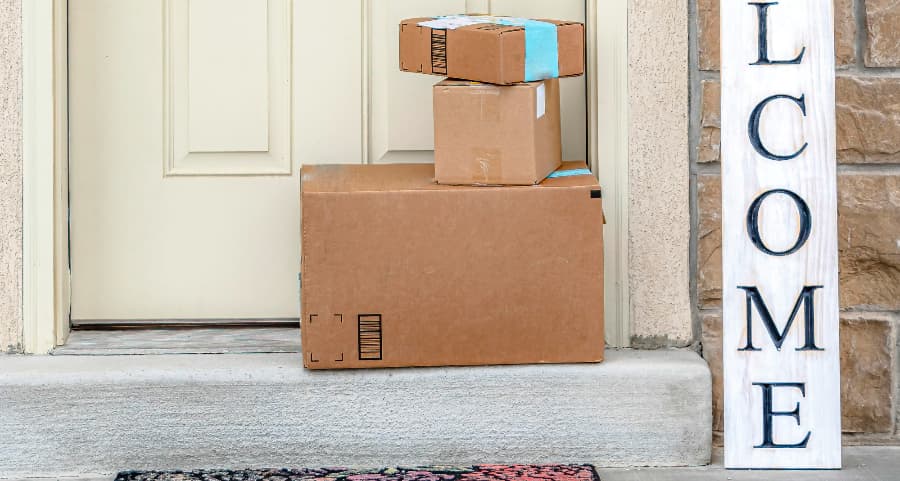 Deliveries on the front porch of a house with a welcome sign in Long Island